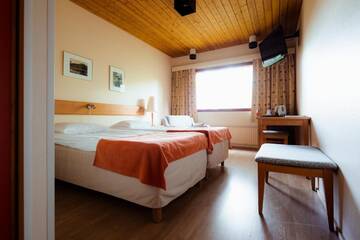 Фото номера Двухместный номер эконом-класса с 2 отдельными кроватями Отель Lapland Hotels Äkäshotelli г. Экясломполо 5